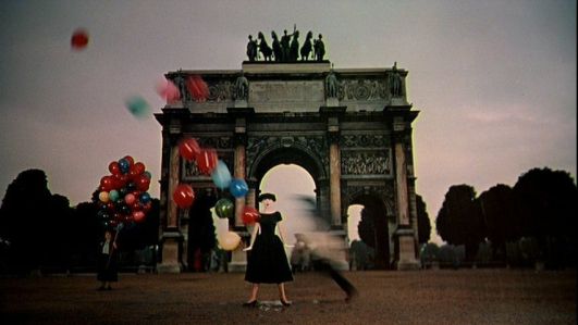 funny-face-audrey-hepburn-black-dress-balloons-arc-de-triomphe-1-50s-vintage-clothing